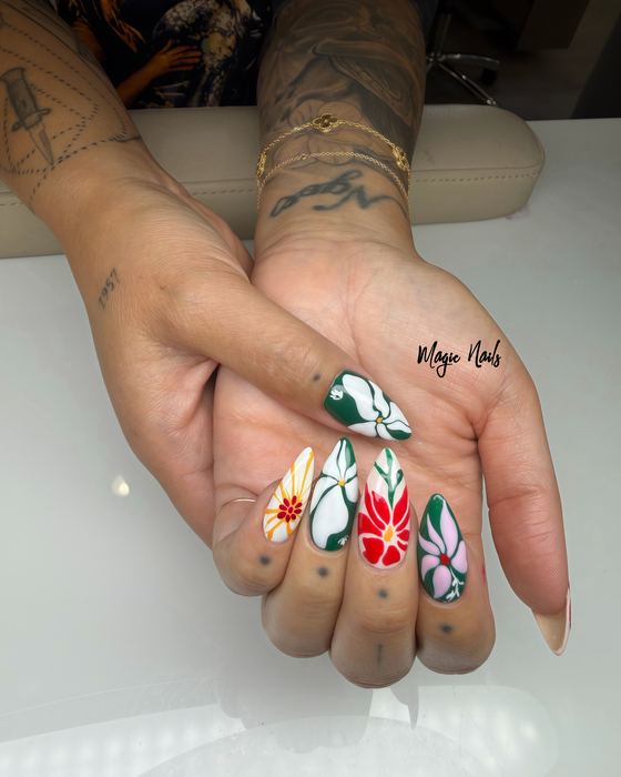 Almond nails with hand-painted tropical flowers in red, white, pink and deep green