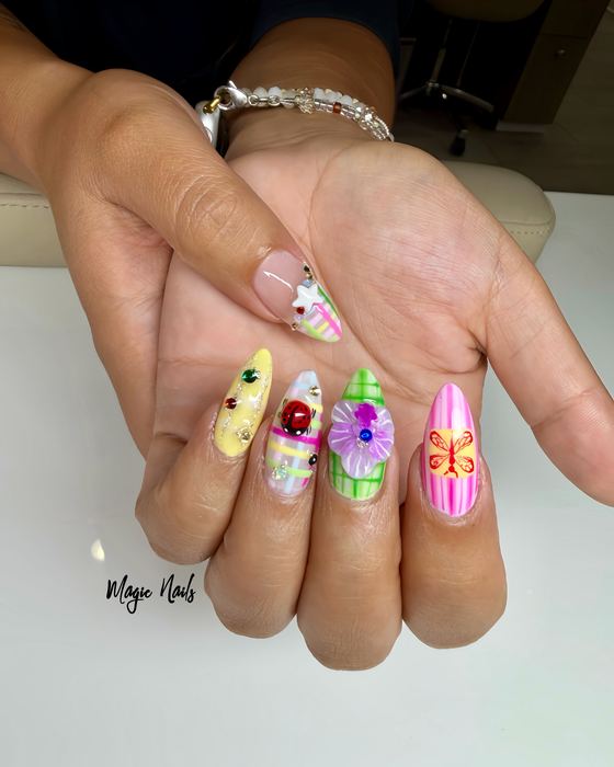 Colourful hand-painted nail art with flowers, butterflies and pastel designs